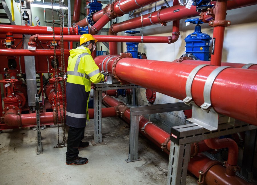 Technicians servicing heavy plant machinery during a maintenance shutdown